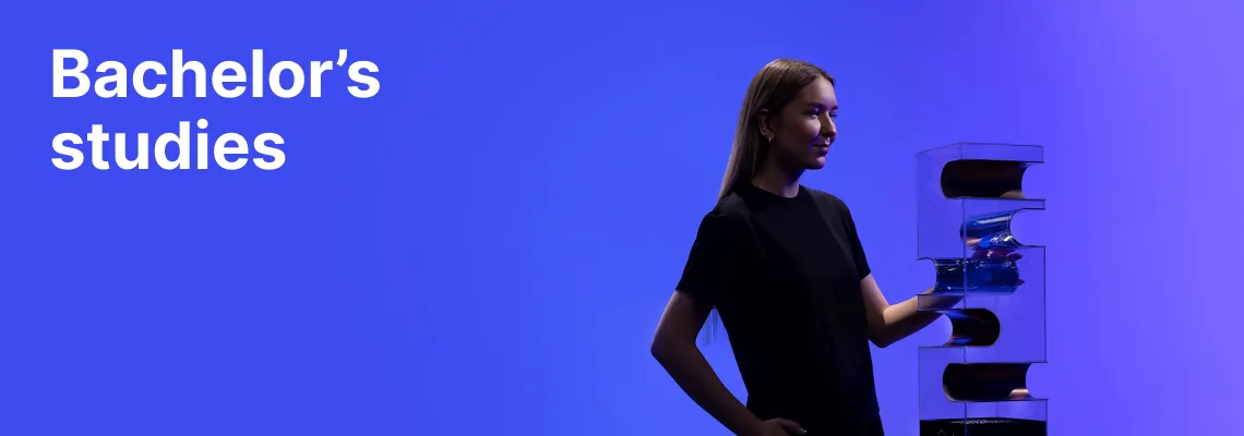 A KTU Faculty of Mechanical Engineering and Design student working with technological equipment against a blue decorative background. The faculty offers bachelor's studies. Choose KTU bachelor's studies.
