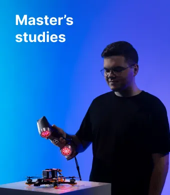 A KTU Faculty of Mechanical Engineering and Design student scanning drone components against a blue decorative background. The faculty offers master's studies. Choose KTU master's studies.
